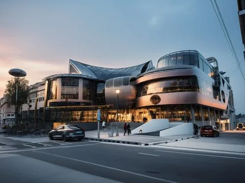 REMODELACION DE UNA PLAZA COMERCIAL, CON ARQUITECTURA NOVEDOSA,the entrance of a building sits at dusk,mercedes-benz museum,kristiansand,kunsthaus,macewan,morphosis,cornerhouse,Photography,General,Rea