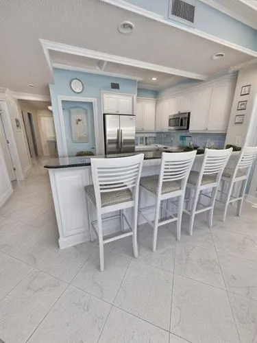 paint the cabinets white and add modern handles, change the countertop to pure white quartz, add blacksplash between the cabinets, paint the walls in light blue only.,kitchen & dining room table,famil