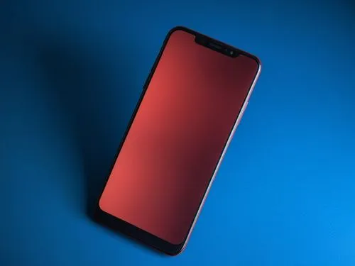 the phone is shiny and red on a blue surface,meizu,red blue wallpaper,ifa g5,samsung wallpaper,zte,on a red background