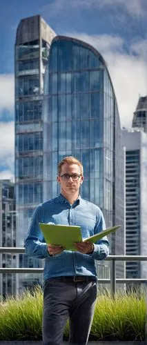 Modern architect, male, 30s, bespectacled, short hair, casual wear, holding blueprint, standing, New Zealand, Auckland, cityscape, skyscraper, glass façade, steel frame, urban planning, green roof, su