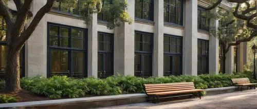 Savannah GA, historic district, Southern colonial style, architectural firm, modern office building, glass facade, wooden doors, stone walls, green roof, lush greenery, outdoor seating area, wooden be