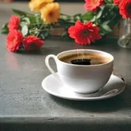 en una mesa junto a un carros con dos flores rojas,floral with cappuccino,espresso,cuban espresso,caffè americano,coffee background,caffè macchiato,a cup of coffee,dandelion coffee,espressino,kopi luw