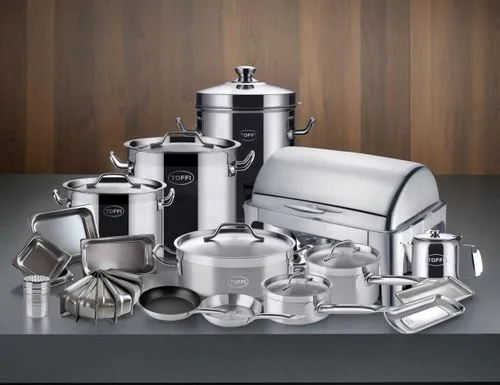 Commercial kitchen, cool tone, dark background,a table topped with pots and pans next to each other,baking equipments,cookware,kitchenware,bakeware,kitchenaid,cookstoves,metalware,breville,kitchen ute