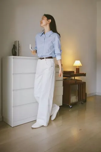 a woman stands on her chest and looks up,dehumidifiers,highboard,housekeeping,hemnes,cleaning service,dumbwaiter,dehumidifier,eero,folding table,housekeeper,anastassiades,cleaning woman,talalay,dehumi