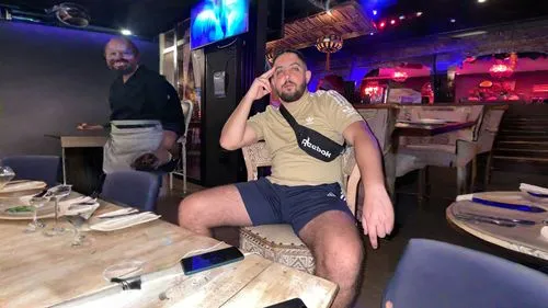 restaurante with modern lighting . tv screen,karaoke,serving,club chair,steakhouse,thriving,looking through legs,foodie,birthday template,party dad,long legs,skort,bar stools,fine dining,serve,in shor