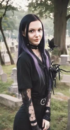 Black hair tattoed goth emo girl with spiders in a cemetery garden. There are same black birds in the sky. ,goth woman,gothic woman,goth festival,cemetary,goth like,goth whitby weekend,gothic fashion,