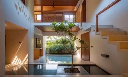 Create similar images with part double heights and part bali style courtyards with entrance foyer looking into an internal courtyard on the first floor and an external courtyard with an artistic frang