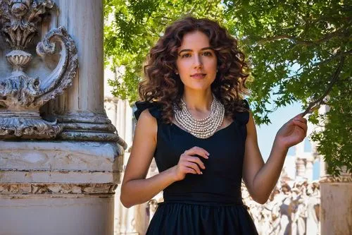 Venetian Gothic architecture, 17th century style, Biennale exhibition, solo female artist, elegant black dress, pearl necklace, curly brown hair, subtle makeup, standing, gesturing, holding a large wh