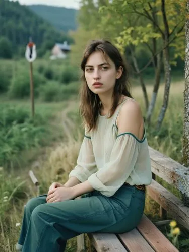 Sabina on the meadow, wearing hot pants and waiting for her boyfriend Ulrich.,a woman in a green suit sitting on a wooden bench,kieslowski,girl sitting,relaxed young girl,elisa,svitlana,kreuk,Photogra