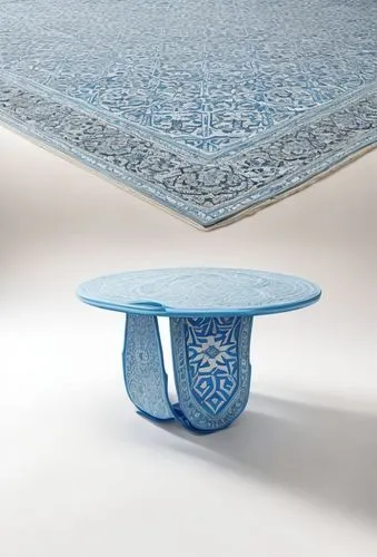 Table with saddle-shaped base made of molded sky blue polyethylene with reliefs in Turkish rug pattern, more plasitc looking
,ottoman,danish furniture,moroccan pattern,majorelle blue,ikat,mazarine blu