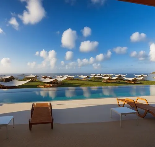 a couple of chairs sit by the edge of a pool,amanresorts,caicos,mustique,exuma,anguilla,grenadines,Photography,General,Realistic