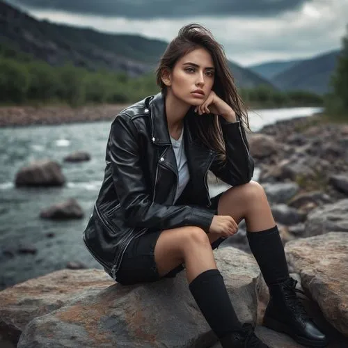 generate a image of an female thinking about her family, Background is sitting along river side on rocks, Eyes full of tears, Side face of a female, her eyes are like Salina gomez, hieght 5.9, Fit gir