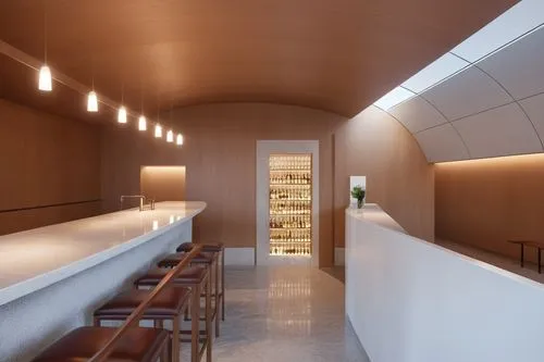 bar with cherry oak john pawson style, and white stone bar,the bar in a restaurant is very clean,wine bar,bellocq,liquor bar,vaulted cellar,wine boxes,servery,icewine,associati,bar counter,armagnacs,c