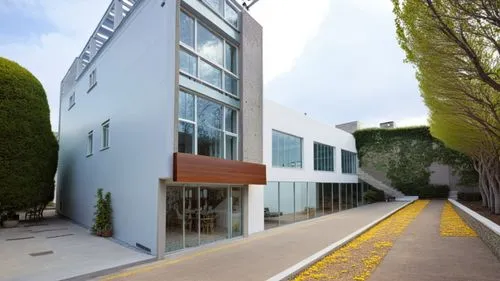 a building that has many windows and a sidewalk,javeriana,esade,institucion,casa fuster hotel,instituto,metaldyne,Photography,General,Realistic