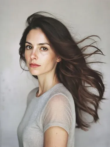 a woman with long, wavy brown hair,a woman standing with her hair flying in the wind,andreasberg,haselrieder,koechlin,kreuk,dillahunt,pantene,Photography,Documentary Photography,Documentary Photograph