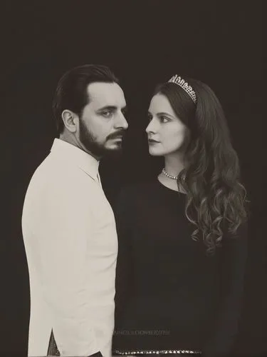 Official black and white photo double portrait of Their Majesties King Charles I and Queen Olga of Württemberg.,a man and a woman posing for a portrait,nawabs,haider,filmfare,vintage man and woman,guj