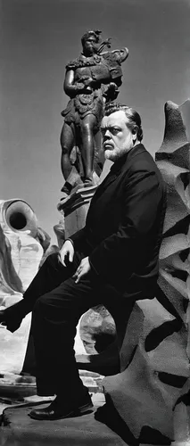 Orson Welles Resting On A Sculpture Photograph by Cecil Beaton,sculptor ed elliott,man with saxophone,sculptor,dali,saxophone playing man,surrealism,el salvador dali,ervin hervé-lóránth,the sculptures