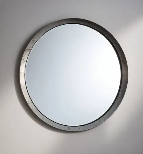 A mirror frame made of metal with a crack in middle of different shapes,a circular mirror on the wall shows the reflection of soing in it,parabolic mirror,exterior mirror,circle shape frame,round fram