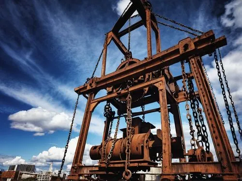 Winch design, industrial architecture, complex machinery, metallic texture, rusty color, intricate details, pulleys, chains, gears, steel beams, concrete foundation, urban background, cityscape, cloud