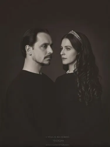 Official full-length black and white portrait of Their Majesties King Charles I and Queen Olga of Württemberg.,a couple is shown in this black and white po,gothic portrait,addams,vintage man and woman