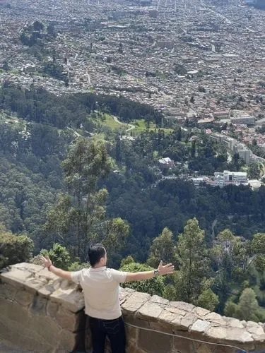 a man is standing at the top of a mountain and looking down,rubidoux,ehden,duhok,klis,lycabettus,queretaro,cuernavaca,bikfaya,guanajuato,kruja,zgharta,cahuenga,pena de bernal,granada,above the city,ch