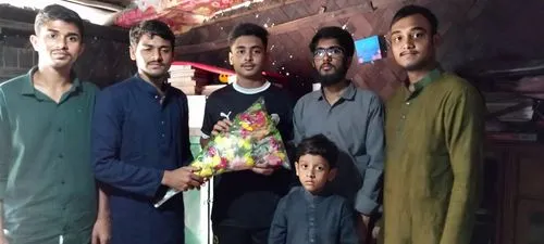 a group of men standing together with one holding a baby,shyambazar,mohammadpur,faridpur,bowbazar,akhtaruddin,bagerhat,khandan,bagbazar,dangal,madaripur,uttar,ravenshaw,dinajpur,baruipur,lalmonirhat,a