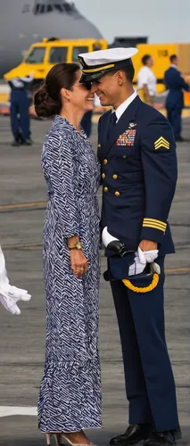 A Naval officer is greeted by his wife as the USS Abraham Lincoln arrives at its new home at Naval Air Station North Island on Coronado.,navy burial,ceremony,mother kiss,color image,hnl,ceremonial,pda