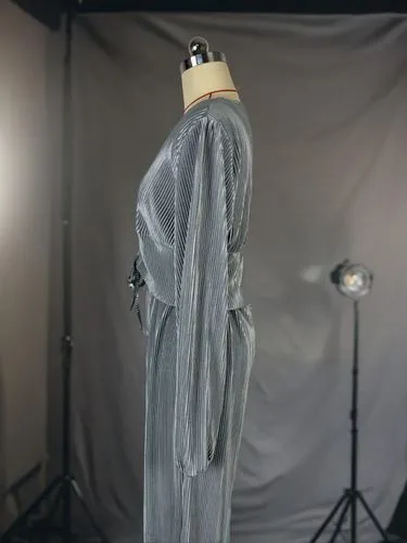 a po shoot with the back of a dress on a mannequin,a floor-length dress,draping,harness cocoon,dress form,drape,raw silk