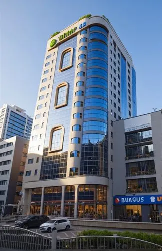 a very tall el building next to cars,ulaanbaatar centre,largest hotel in dubai,rotana,microtel,atyrau,hongdan center,novotel,mubadala,mashreq,turkbank,tveruniversalbank,addis ababa,astana,omantel,stan