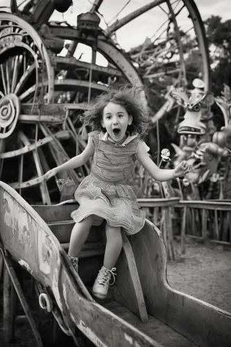 little girl in wind,amusement ride,fairground,funfair,girl with a wheel,photographing children,little girl running,amusement,roller coaster,merry go round,adventure playground,amusement park,children's ride,merry-go-round,carousel,annual fair,children play,inner child,vintage children,big wheel,Photography,Black and white photography,Black and White Photography 02