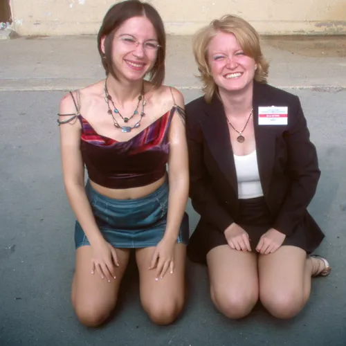 two women, wearing mini skirt, thick legs, on her knees on the ground, high angle photography,two girls,businesswomen,business women,receptionists,china massage therapy,lotus position,virtuelles treff