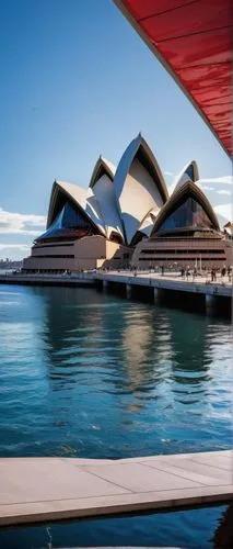 Sydney Opera House, architectural design, iconic building, harbor views, white concrete roof, series of interlocking arches, glass facade, metallic frames, grand staircase, red carpet, ornate details,