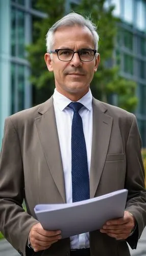 Middle-aged, mature male professor, bespectacled, short grey hair, formal attire, suit, white shirt, tie, holding a large folder, standing in front of a modern university building, glass walls, steel 