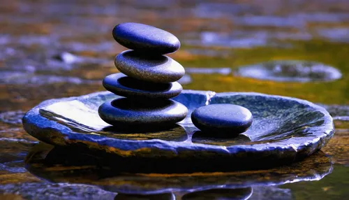 Create a reflective poem about the balance found in zen stones.,stacking stones,balanced pebbles,stone balancing,stack of stones,zen stones,rock stacking,balanced boulder,rock balancing,stacked rocks,