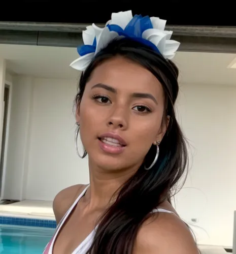 She attends a bachelorette party at the pool and is dressed accordingly in blue and white with a bouquet of flowers on her head.  Party atmosphere, dancing, joy, music and fun.,krsmanovic,mauritians,n