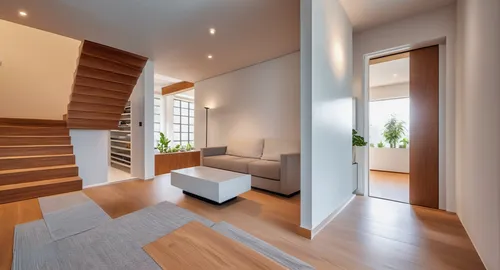 Modern family room between steps that connects the various levels of the house and access to one of the bedrooms. Minimalism interior style.,hardwood floors,wooden stair railing,wooden stairs,interior