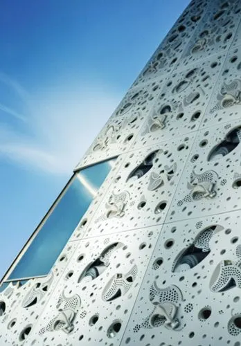 
building facade close-up.,an architectural building with holes on the side of it,climbing wall,concrete construction,structural plaster,concrete ceiling,cheese grater,metal cladding,Photography,Gener