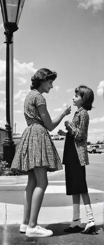 Create a short scene where a strained friendship is repaired through an act of kindness.,vintage 1950s,50's style,vintage girls,little girls walking,vintage children,fifties,vintage fashion,pin-up gir