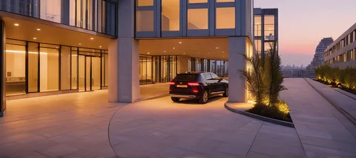 Residential glass building in Manhattan new York Luxury high end. close up look on the drive through and entrance with revolving door.,penthouse apartment,luxury property,car showroom,driveway,undergr