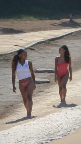 two beautiful women walking down the beach next to each other,micronesians,burkinabes,beach sports,fijians,bdl,bermudians