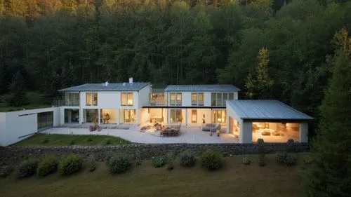 House in the forrest, warm lights from inside. Gray metal roof, ,huset,forest house,lohaus,chalet,villa,exzenterhaus,passivhaus,glickenhaus,landhaus,svizzera,lockenhaus,ludwig erhard haus,country hous