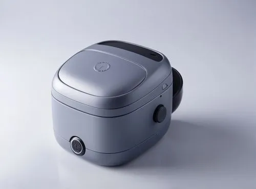 a grey object sitting on a white surface,fidget cube,sega dreamcast,ouya,maaouya,discman,nintendo gamecube,spectrophotometers,humidifier,steam machines,rice cooker,srl camera,dreamcast,3d model,dehumi