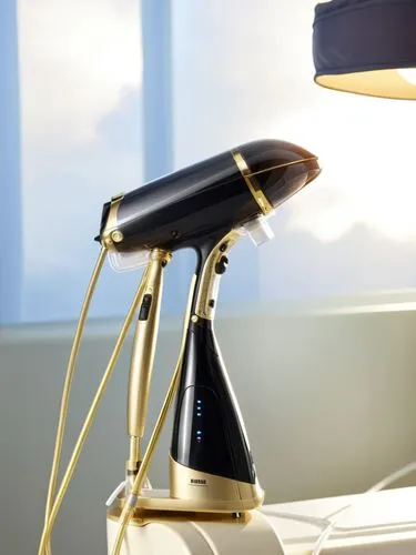 A handheld garment steamer, marketed in Europe and the United States, with a novel appearance, partially decorated with electroplated parts, and rich styling layers,an electric lamp that is on top of 