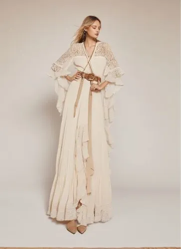 a woman wearing a beige dress is standing,caftan,kaftan,tahiliani,chenoweth,robes,googoosh,Illustration,Realistic Fantasy,Realistic Fantasy 06