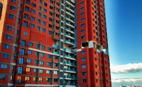 a young women with red hair,tower block,residential tower,high-rise building,high rise building,block of flats,rigshospitalet,norilsk,appartment building,apartment blocks,apartment block,escala,multis