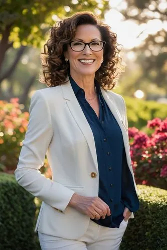 Saylee Greer, mature lady, landscape architect, 35yo, curly brown hair, elegant smile, glasses, business casual attire, blazer, white blouse, dark blue pants, high heels, standing, villa, backyard, lu