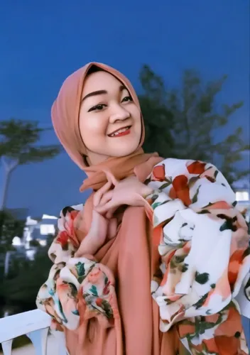 a woman standing by some trees in her headscarf,hijaber,fatin,nurhayati,hijabs,fadilah,tudung