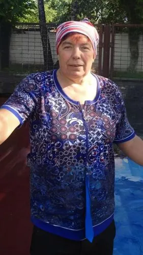 a woman with makeup on her face standing outside,supernanny,female swimmer,rigoberta,putintseva,ostapenko,washerwoman,matveyeva,khudoberdyev,blavatsky,uzbek,mattawoman,supermom,sergeyeva,dubova,zubril