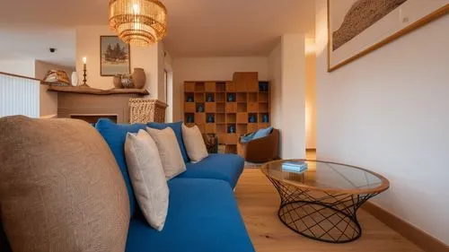 the couches are lined up in the room,contemporary decor,home interior,lettings,appartement,settees,winkworth,inverted cottage,showhouse,sitting room,shared apartment,cohousing,settee,modern decor,furn