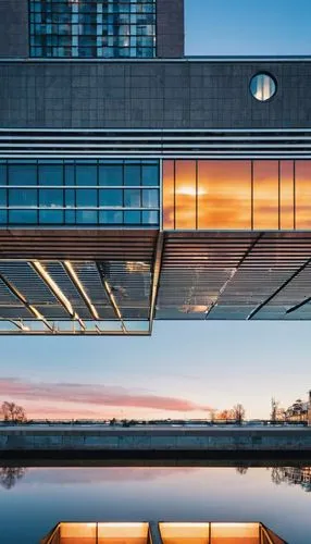 Dubbeldam architecture, modern, futuristic, symmetrical building, sleek lines, minimalist, geometric shapes, glass, steel, concrete, urban, cityscape, Netherlands, Amsterdam, canal, water reflection, 